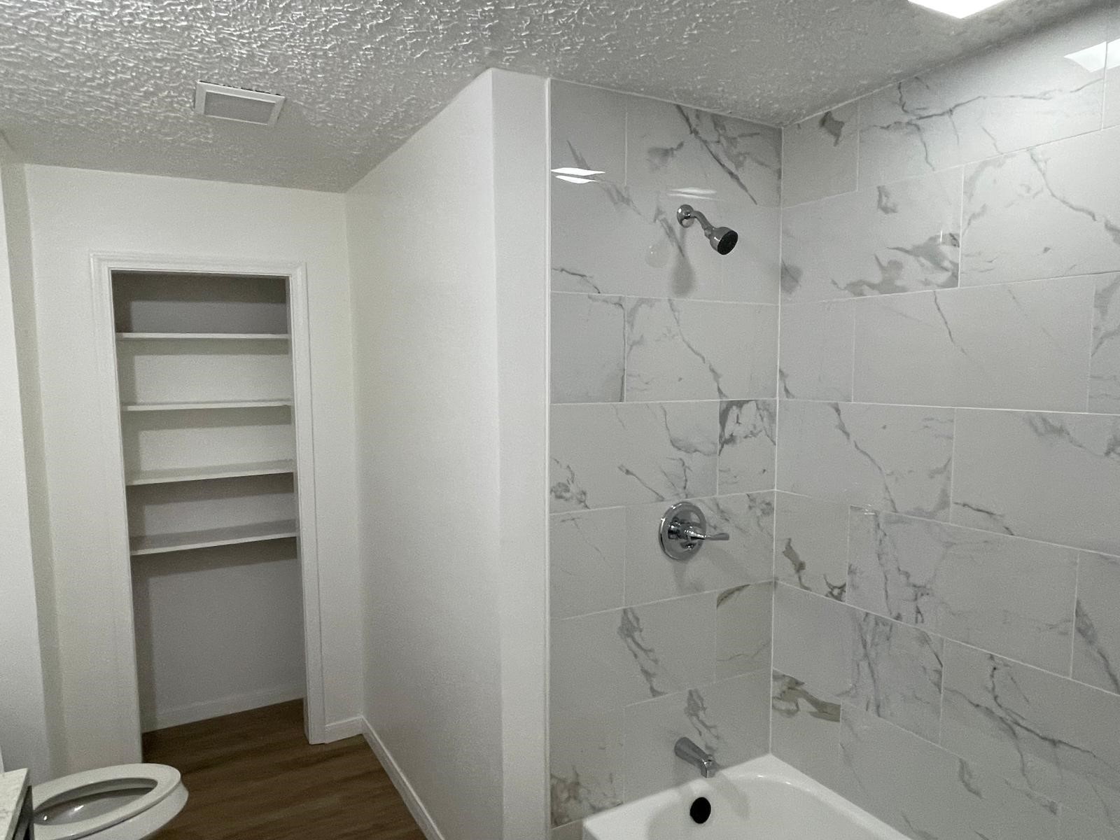 335 Carroll Road Richmond, TX 77469 - Photo 21 of 25 a bathroom with a bathtub