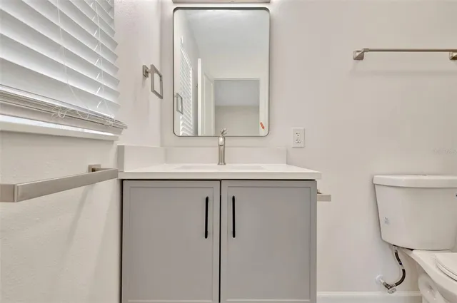 a bathroom with a sink and mirror