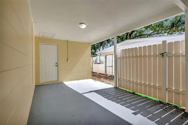 a view of room with a floor to ceiling window and wooden fence