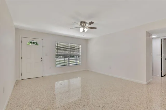 a view of an empty room with a window