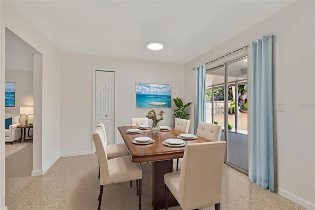 a view of a dining room with furniture window and outside view