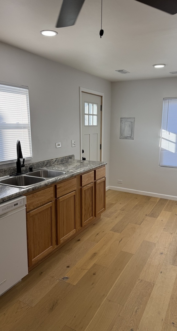 380 Ivanhoe Road Grayslake, IL 60030 - Photo 3 of 7 a kitchen with a sink and cabinets
