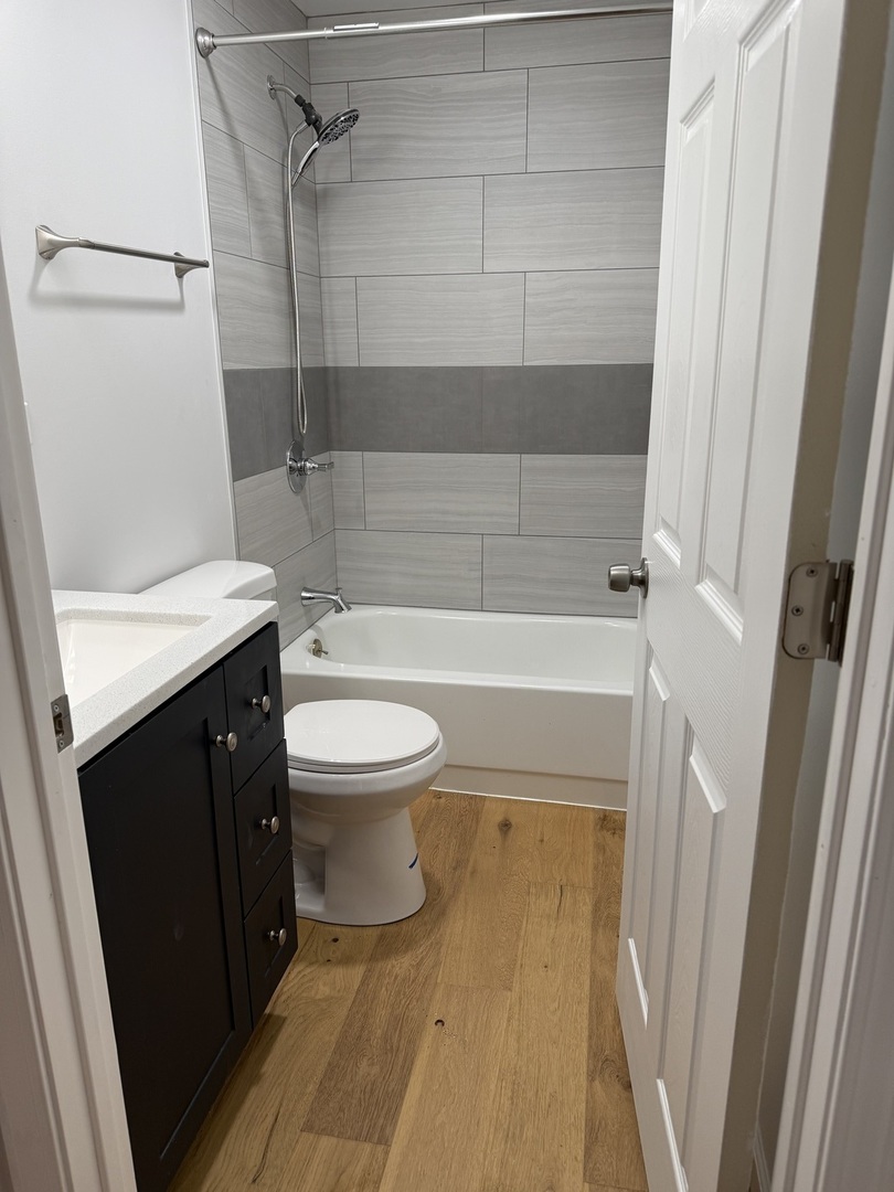 380 Ivanhoe Road Grayslake, IL 60030 - Photo 4 of 7 a bathroom with a sink a toilet and shower