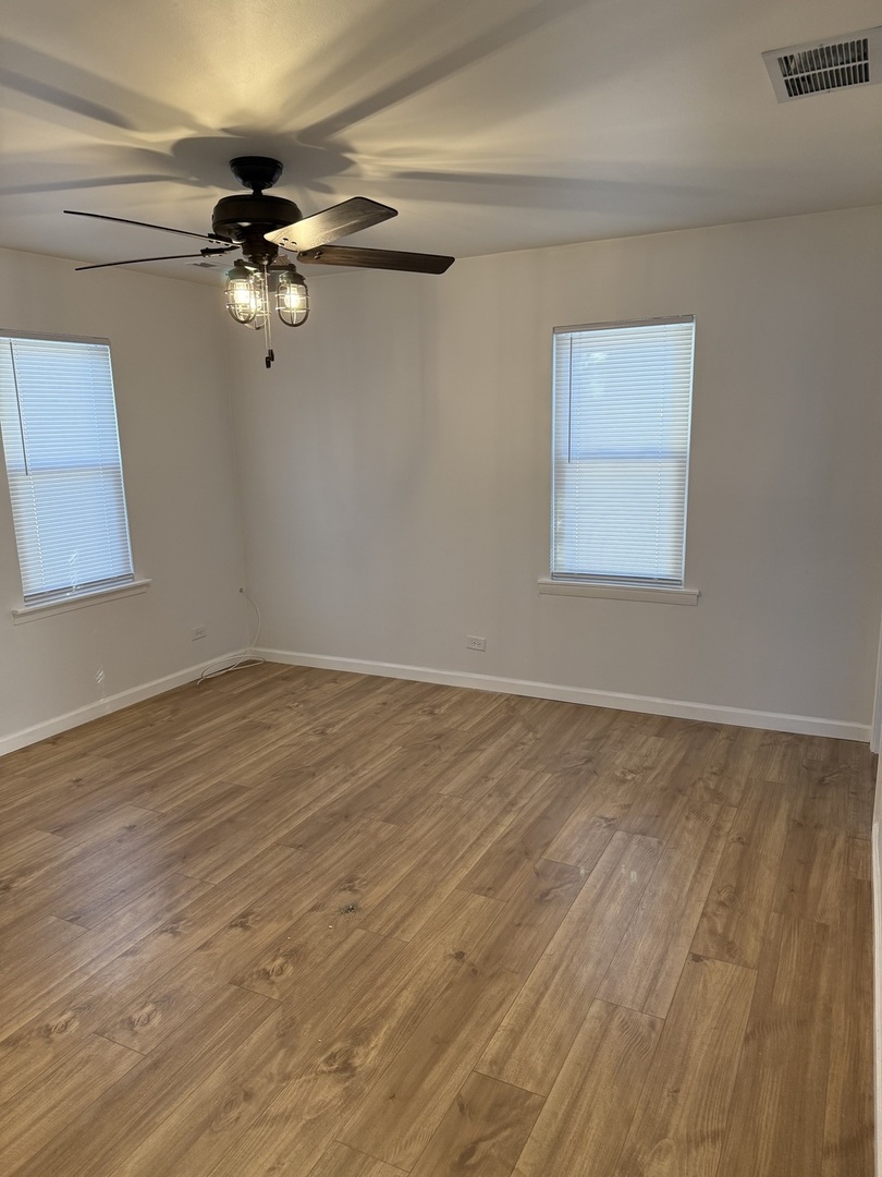 380 Ivanhoe Road Grayslake, IL 60030 - Photo 5 of 7 a view of a room with wooden floor fan and a window