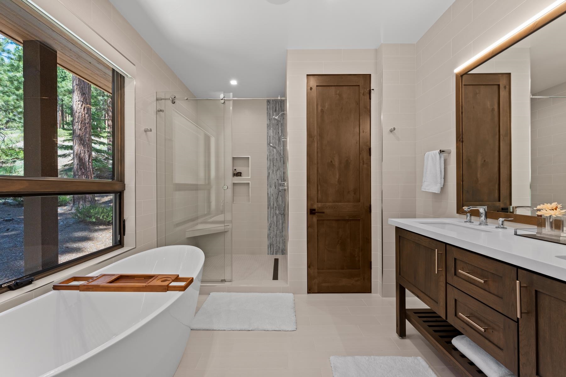 629 Tyner Way Incline Village, NV 89451 - Photo 14 of 27 a spacious bathroom with a double vanity sink a large mirror and a shower