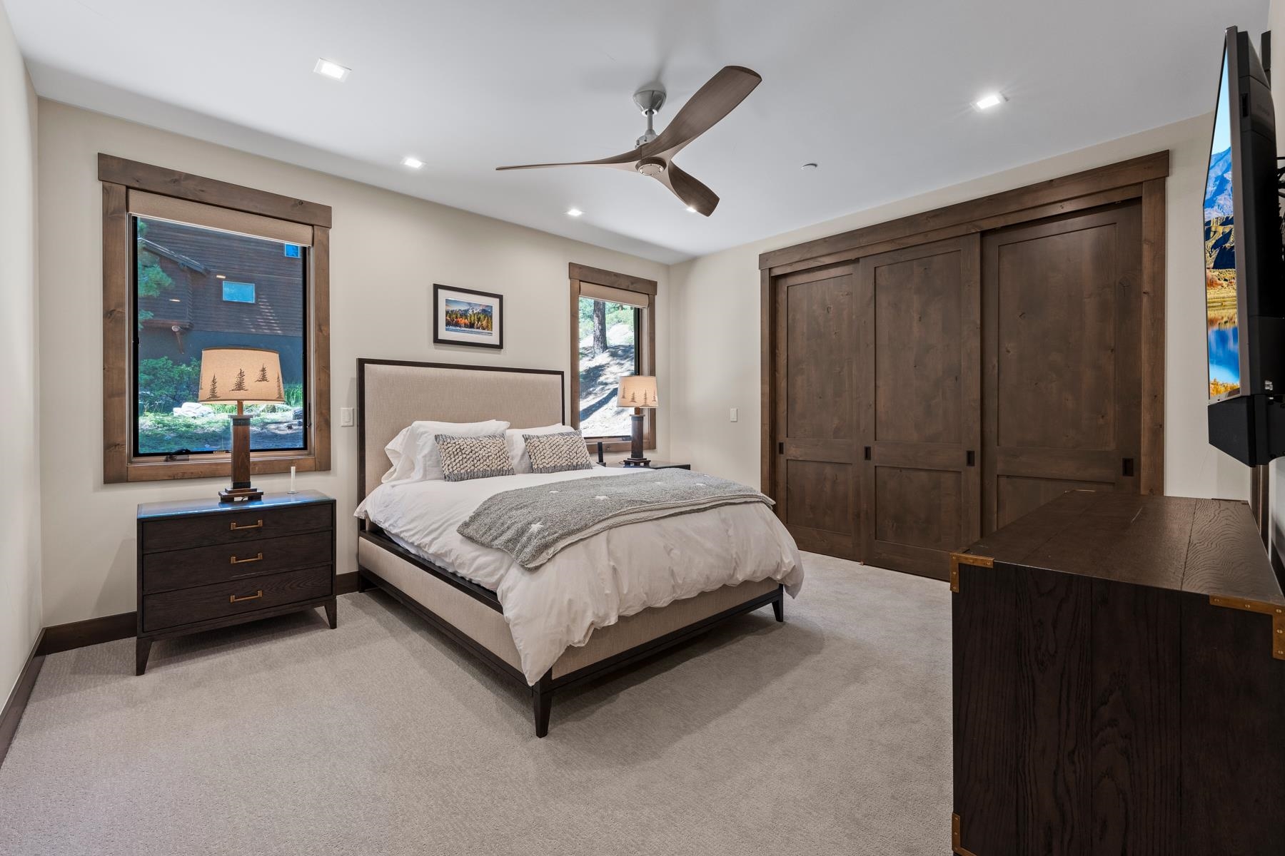 629 Tyner Way Incline Village, NV 89451 - Photo 15 of 27 a spacious bedroom with a bed and a dresser with wooden floor