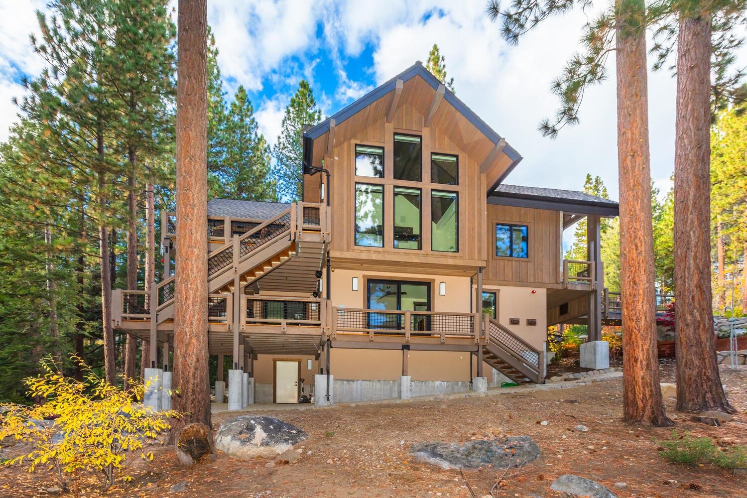 629 Tyner Way Incline Village, NV 89451 - Photo 25 of 27 a view of a brick house with large windows and large tree