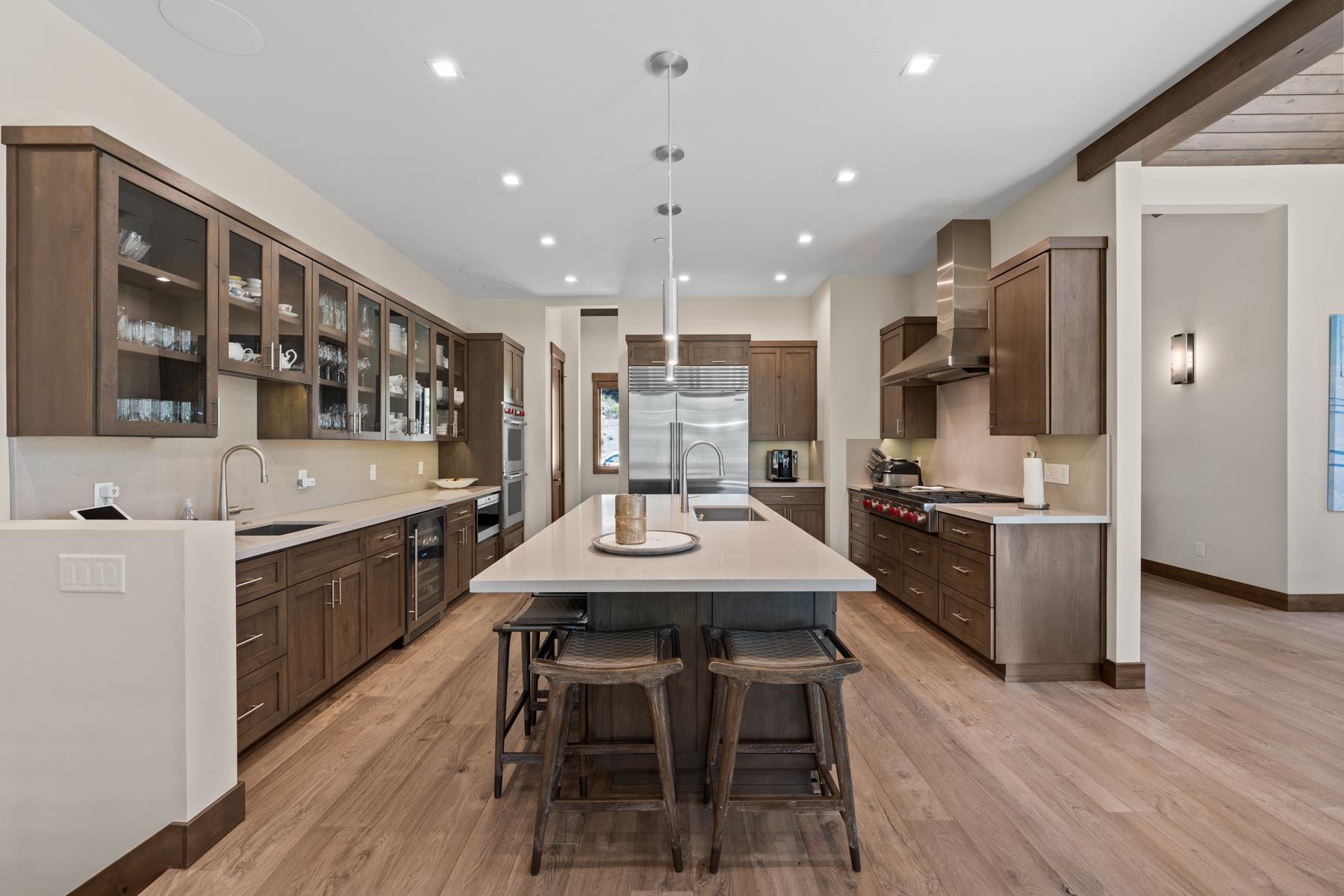 629 Tyner Way Incline Village, NV 89451 - Photo 8 of 27 a kitchen with stainless steel appliances kitchen island granite countertop a table chairs sink and cabinets