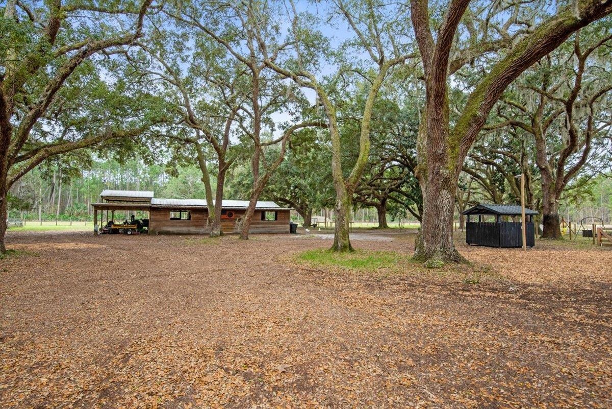 4575 Carter Road St. Augustine, FL 32086 - Photo 12 of 90 a house with trees in front of it