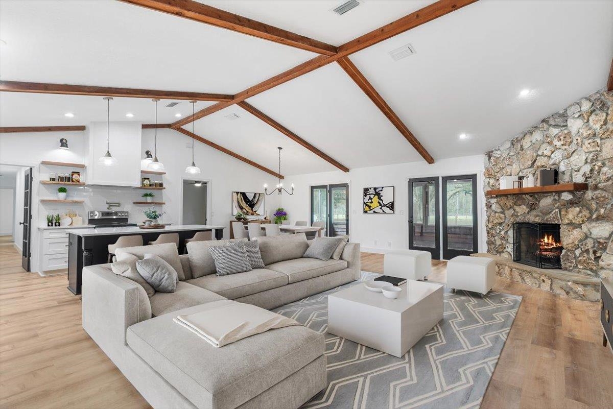 4575 Carter Road St. Augustine, FL 32086 - Photo 2 of 90 a living room with furniture and a fireplace
