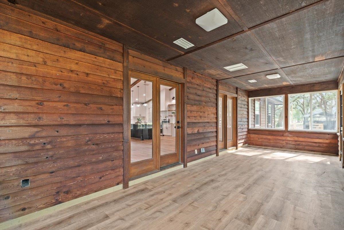4575 Carter Road St. Augustine, FL 32086 - Photo 50 of 90 a view of an empty room with wooden floor and a window