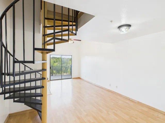 wooden floor in a hall with wooden floor and windows