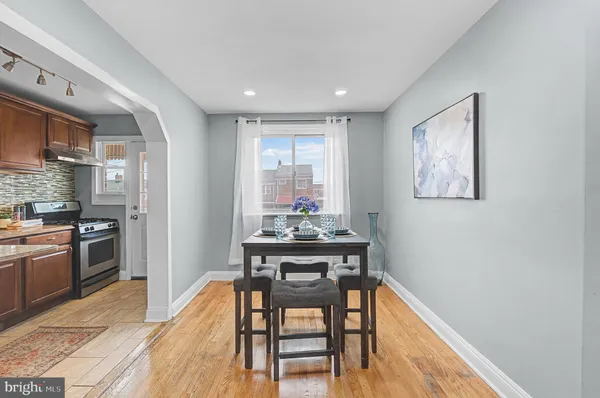 a dining room with furniture and window