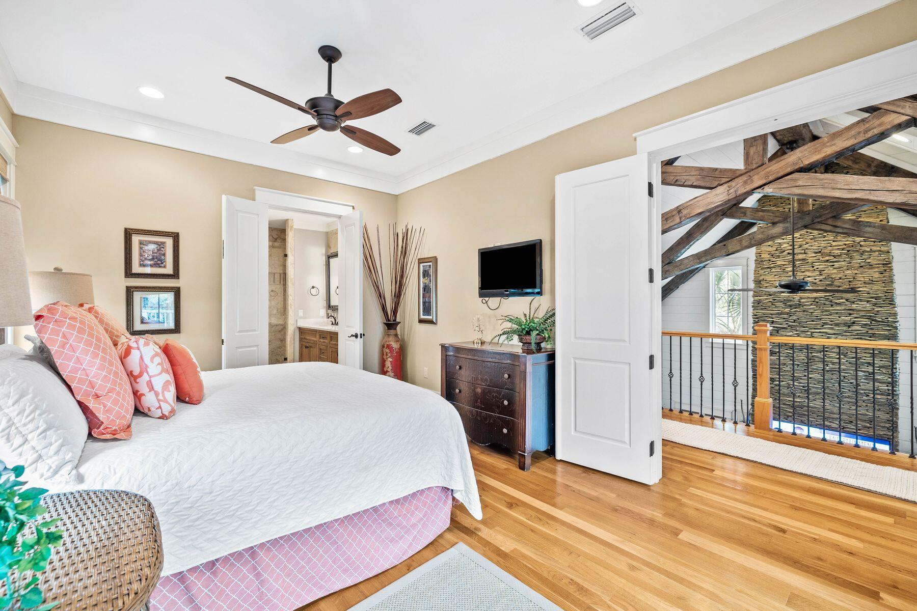 76 Tidepool Lane Watersound, FL 32461 - Photo 15 of 41 a bedroom with a bed closet and a window