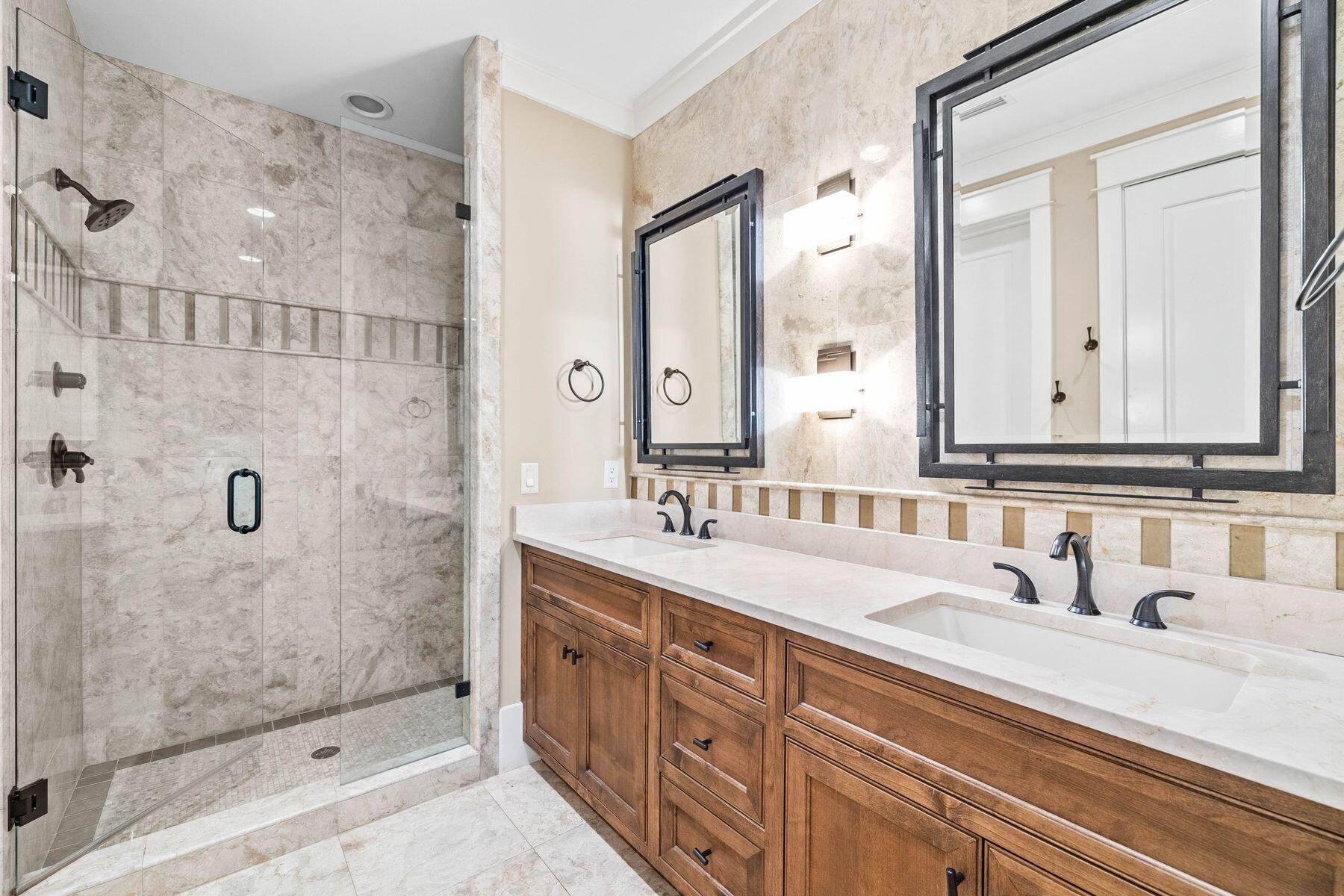 76 Tidepool Lane Watersound, FL 32461 - Photo 16 of 41 a bathroom with a double vanity sink mirror double and shower