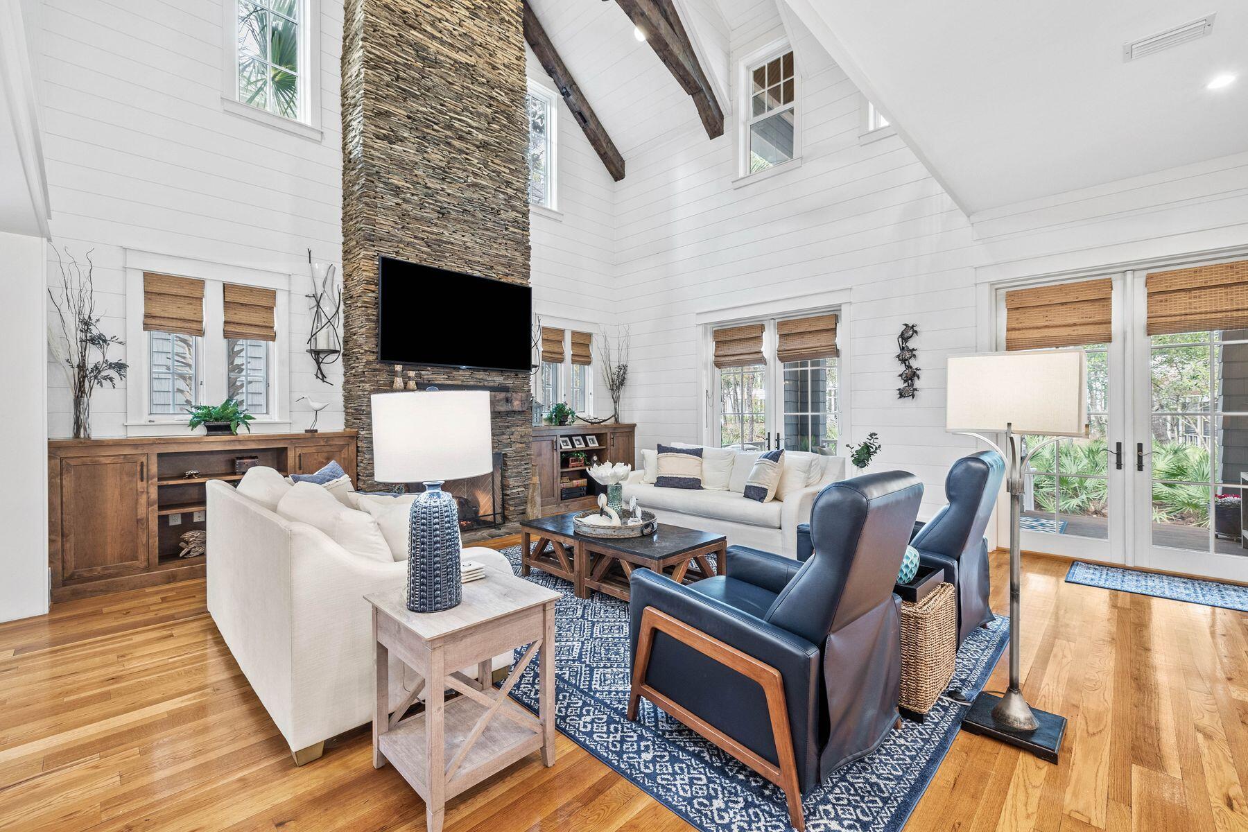 76 Tidepool Lane Watersound, FL 32461 - Photo 2 of 41 a living room with fireplace furniture and a flat screen tv