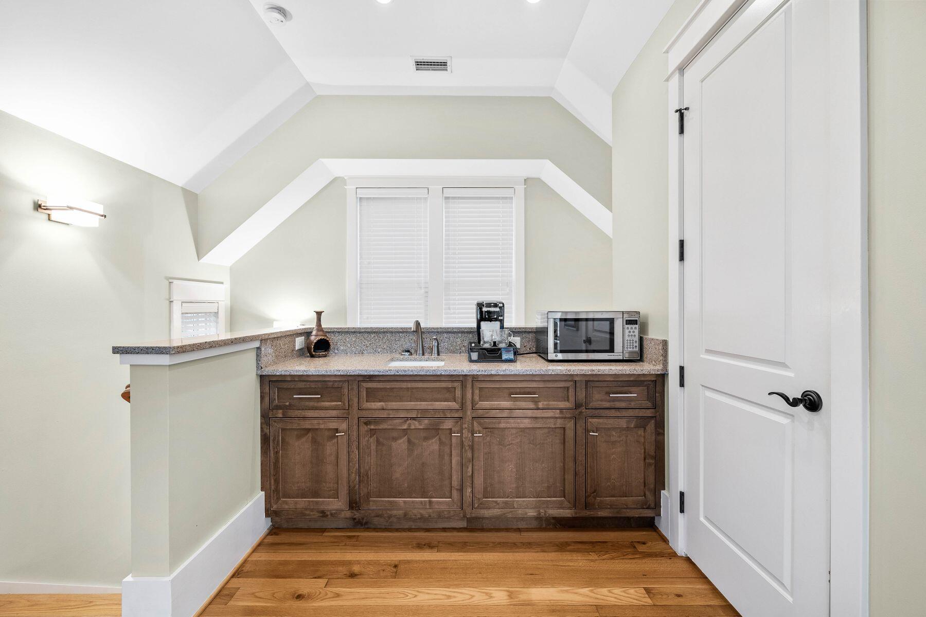 76 Tidepool Lane Watersound, FL 32461 - Photo 22 of 41 a kitchen with sink cabinets and window