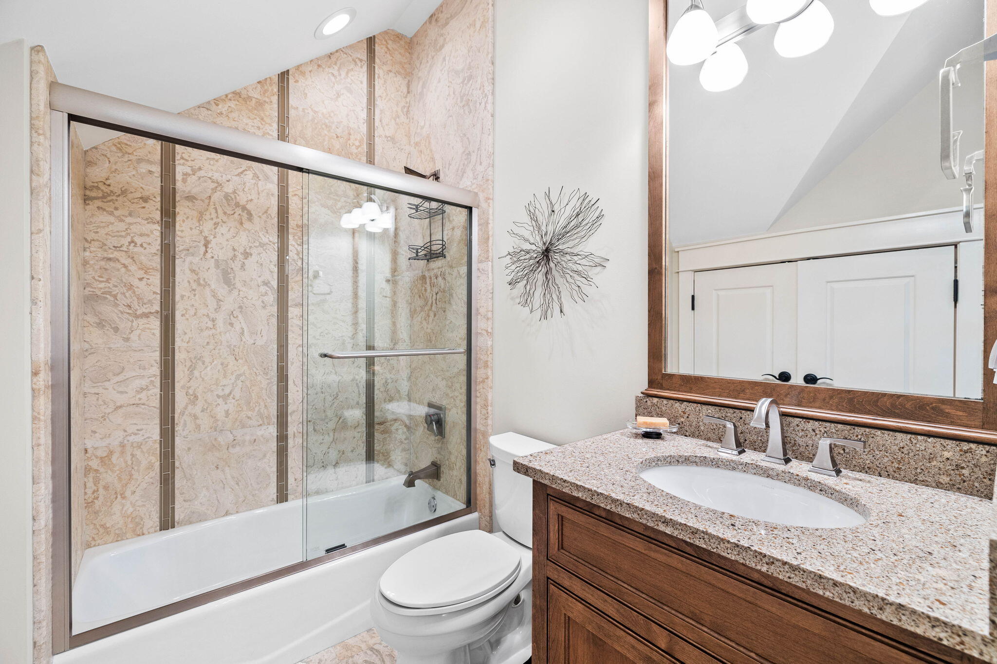 76 Tidepool Lane Watersound, FL 32461 - Photo 23 of 41 a bathroom with a granite countertop sink toilet and shower