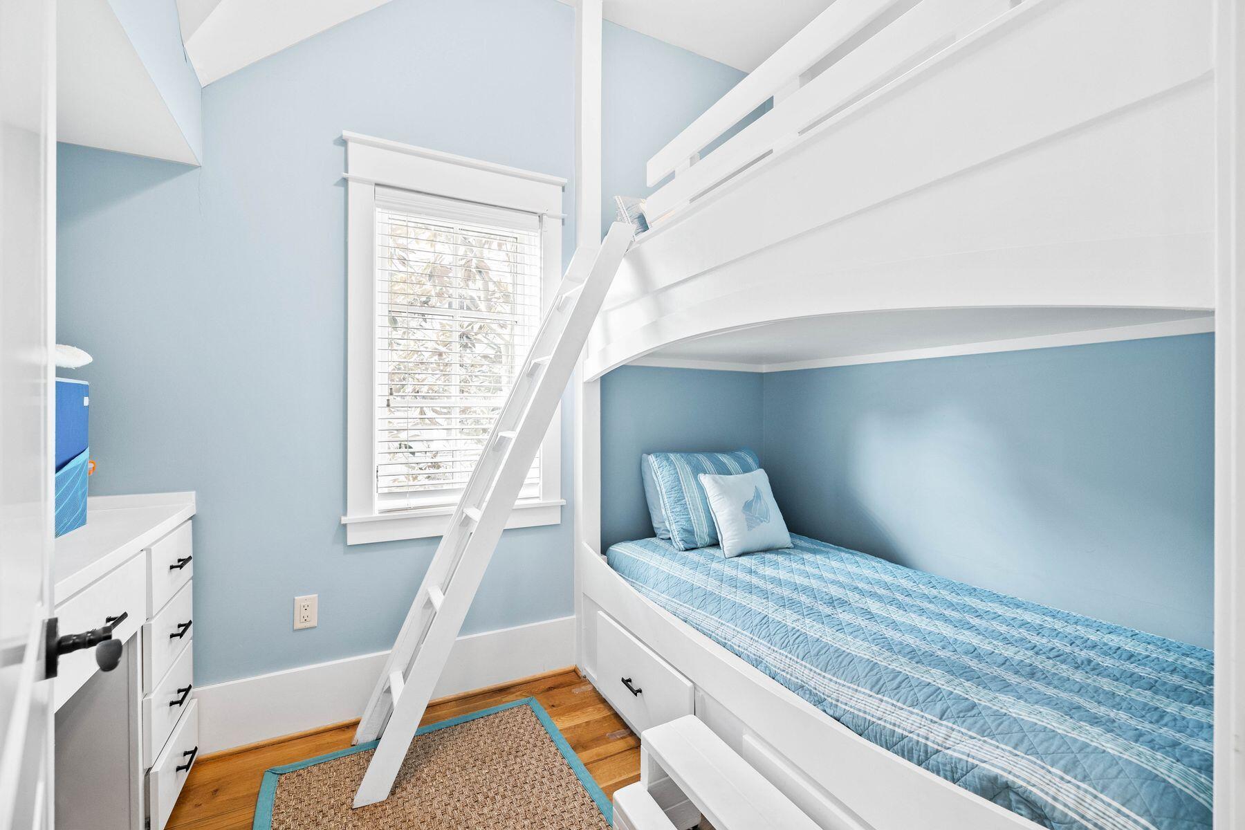 76 Tidepool Lane Watersound, FL 32461 - Photo 24 of 41 a bedroom with a bed and a window