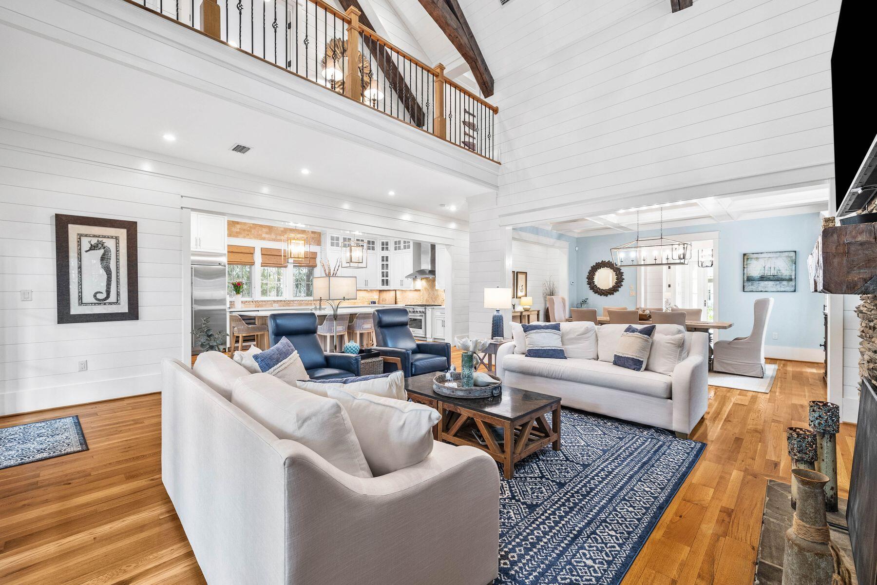 76 Tidepool Lane Watersound, FL 32461 - Photo 3 of 41 a living room with furniture or couch and a wooden floor