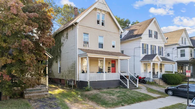 a front view of a house with garden