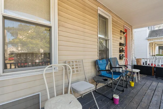 a bathroom with a toilet a sink and a window