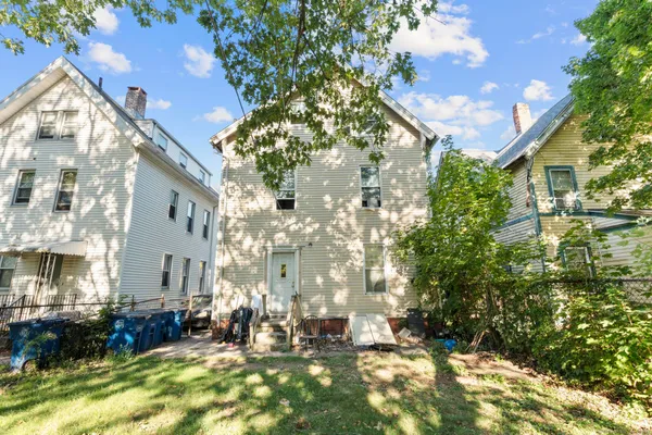a view of house with yard
