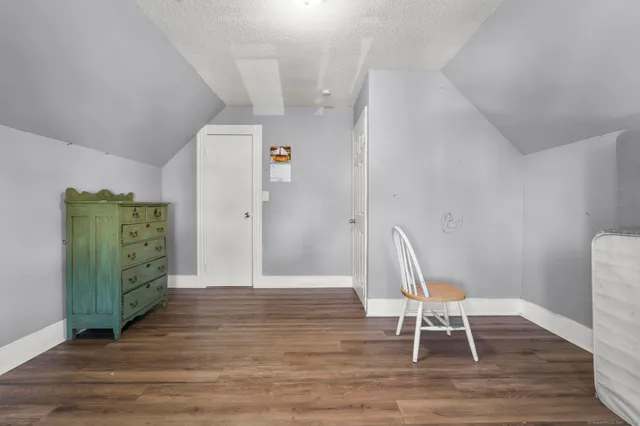 a view of a livingroom with furniture and wooden floor