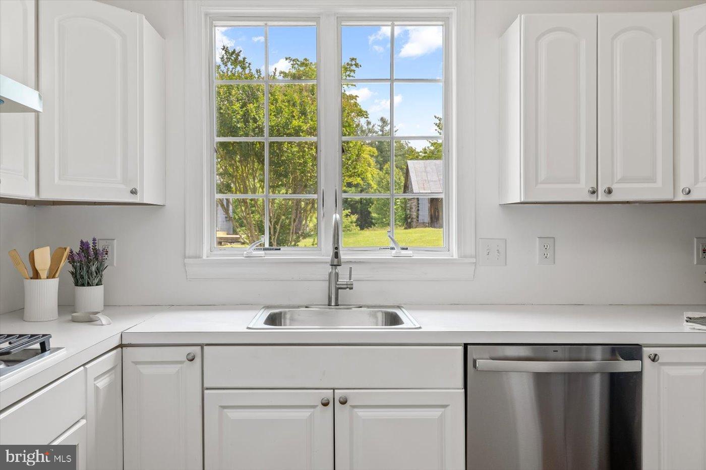 274 A Aaron Mountain Road Castleton, VA 22716 - Photo 17 of 76 Bright kitchen with serene garden views.
