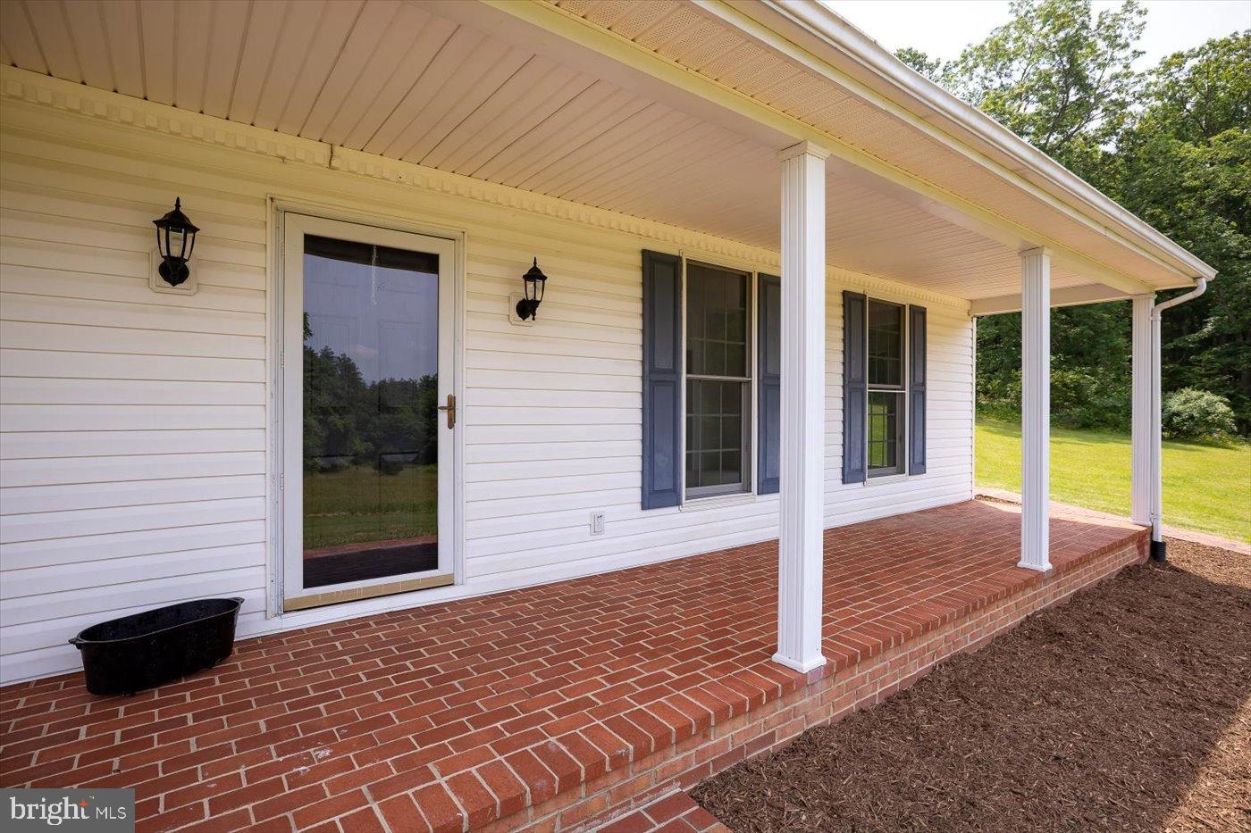 274 A Aaron Mountain Road Castleton, VA 22716 - Photo 35 of 76 Charming porch with inviting brick pathway.