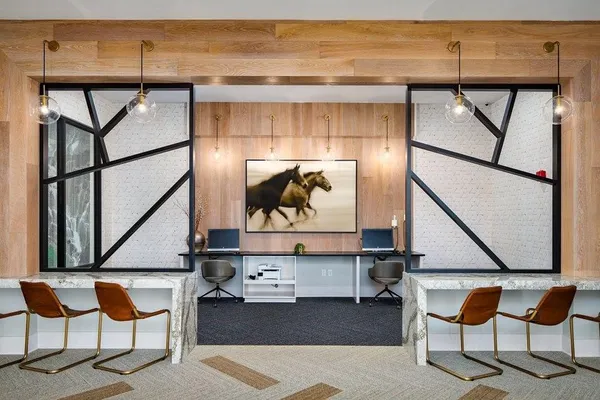 a living room with table and chairs