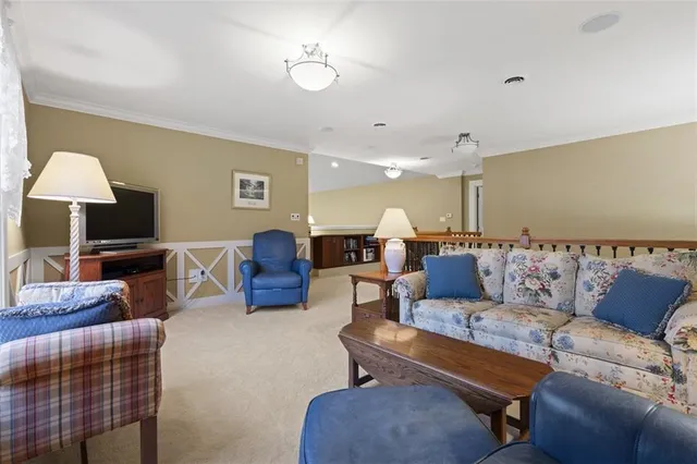 a living room with furniture and a lamp