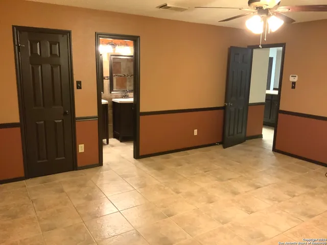 a view of a livingroom with a refrigerator