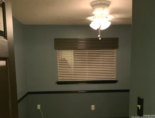 a bathroom with a sink and a chandelier