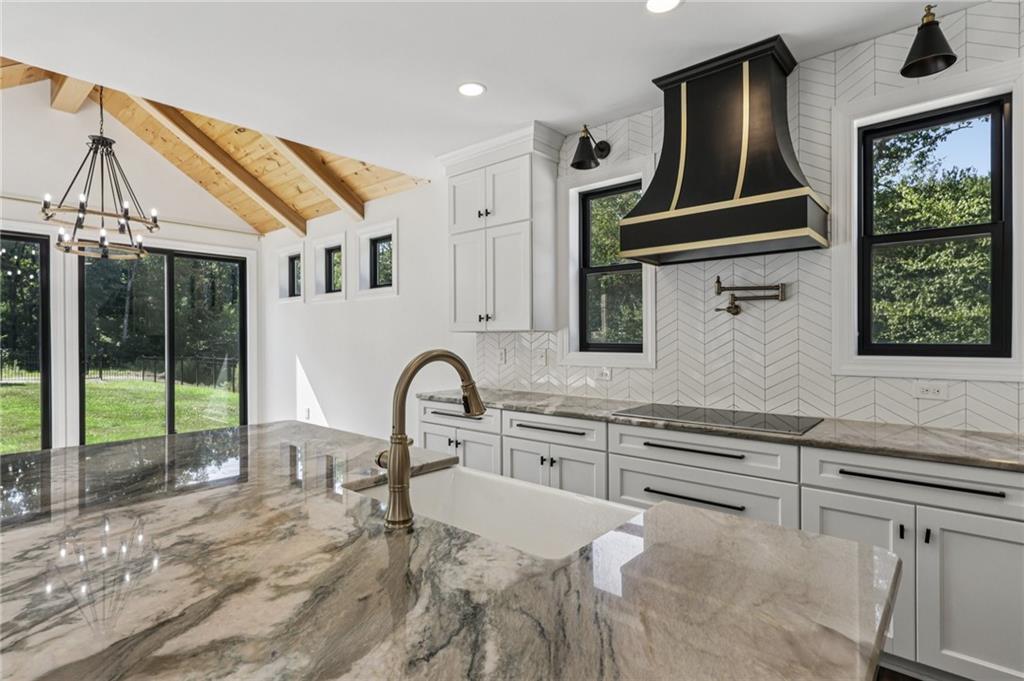 1565 Neville Road Beaver, PA 15009 - Photo 13 of 50 a view of a kitchen with a sink and staircase