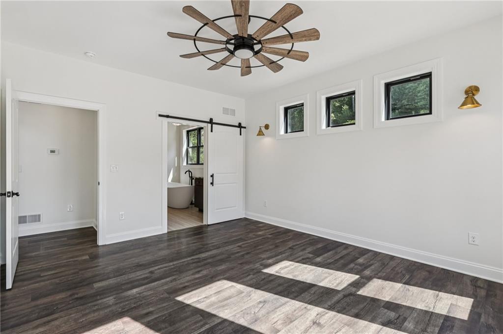 1565 Neville Road Beaver, PA 15009 - Photo 17 of 50 a view of a big room with wooden floor and windows