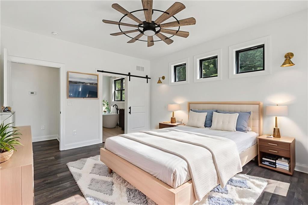 1565 Neville Road Beaver, PA 15009 - Photo 18 of 50 a spacious bedroom with a bed and a chandelier