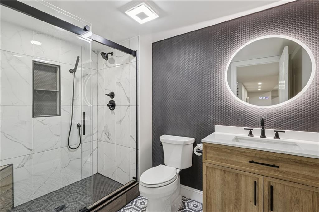 1565 Neville Road Beaver, PA 15009 - Photo 34 of 50 a bathroom with a toilet sink and shower