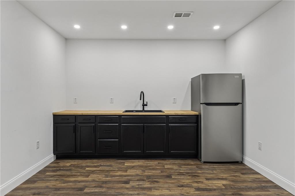 1565 Neville Road Beaver, PA 15009 - Photo 40 of 50 a room with granite countertop a sink and a refrigerator