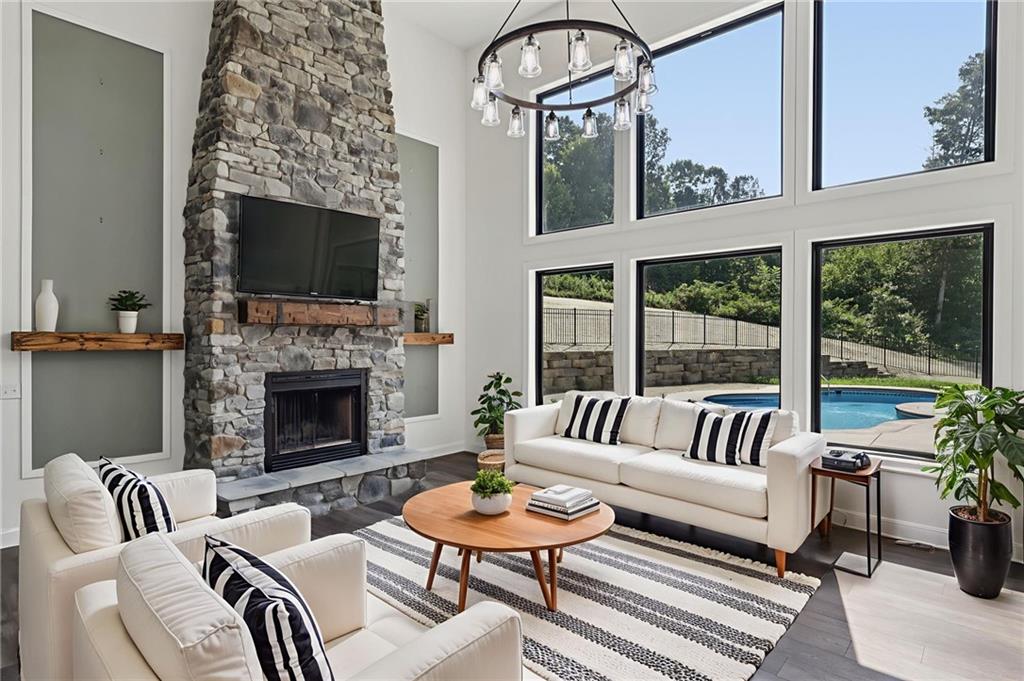 1565 Neville Road Beaver, PA 15009 - Photo 8 of 50 a living room with furniture a fireplace and a flat screen tv