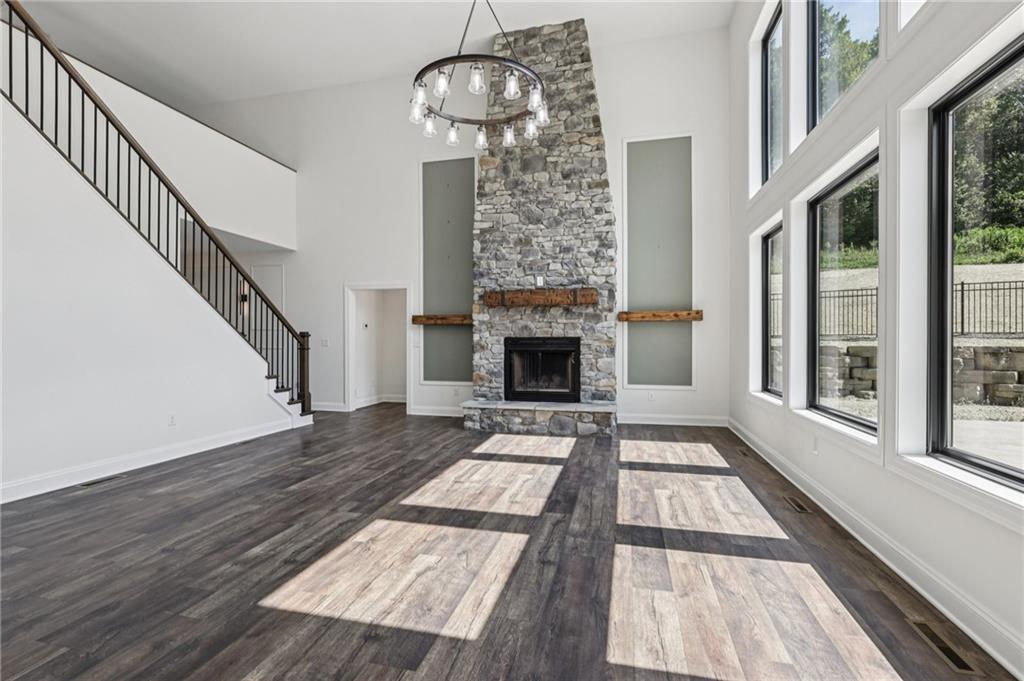 1565 Neville Road Beaver, PA 15009 - Photo 9 of 50 a view of an entryway with wooden floor fireplace and windows