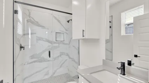 a bathroom with a sink and a shower