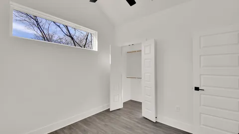 a view of an entryway with wooden floor