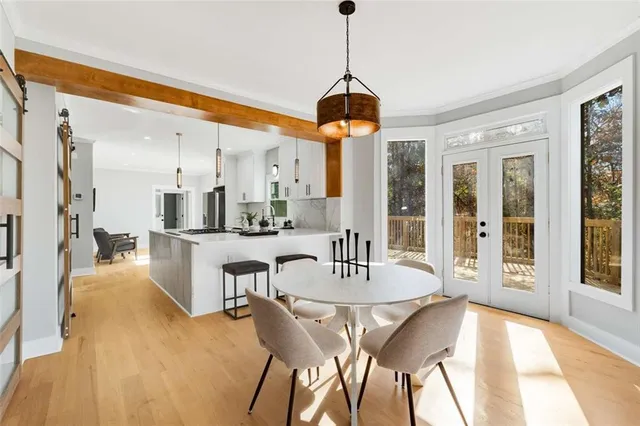 a dining room with furniture and window