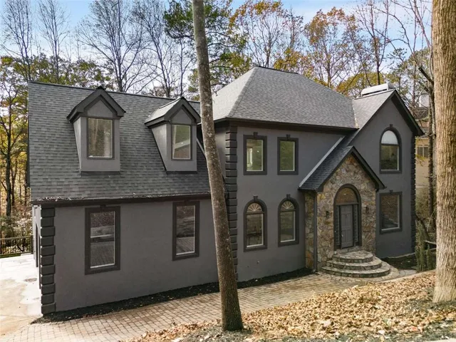 a front view of a house with garden