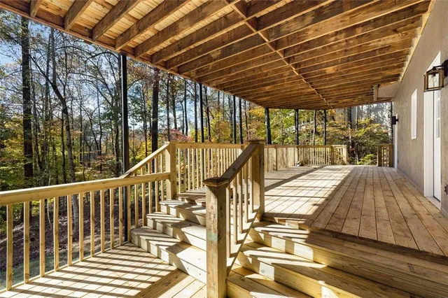 a view of a balcony with wooden floor