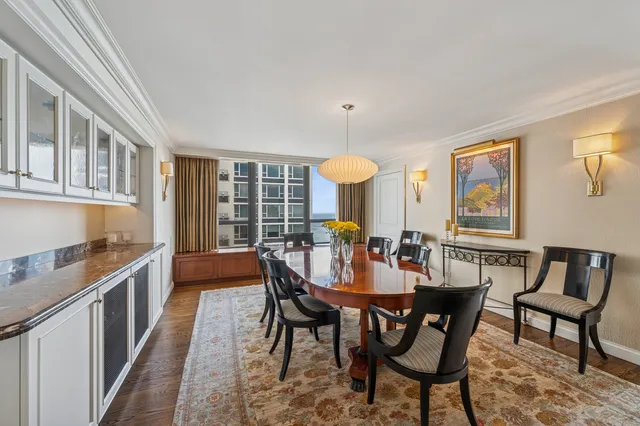 a view of a dining room with furniture window and outside view