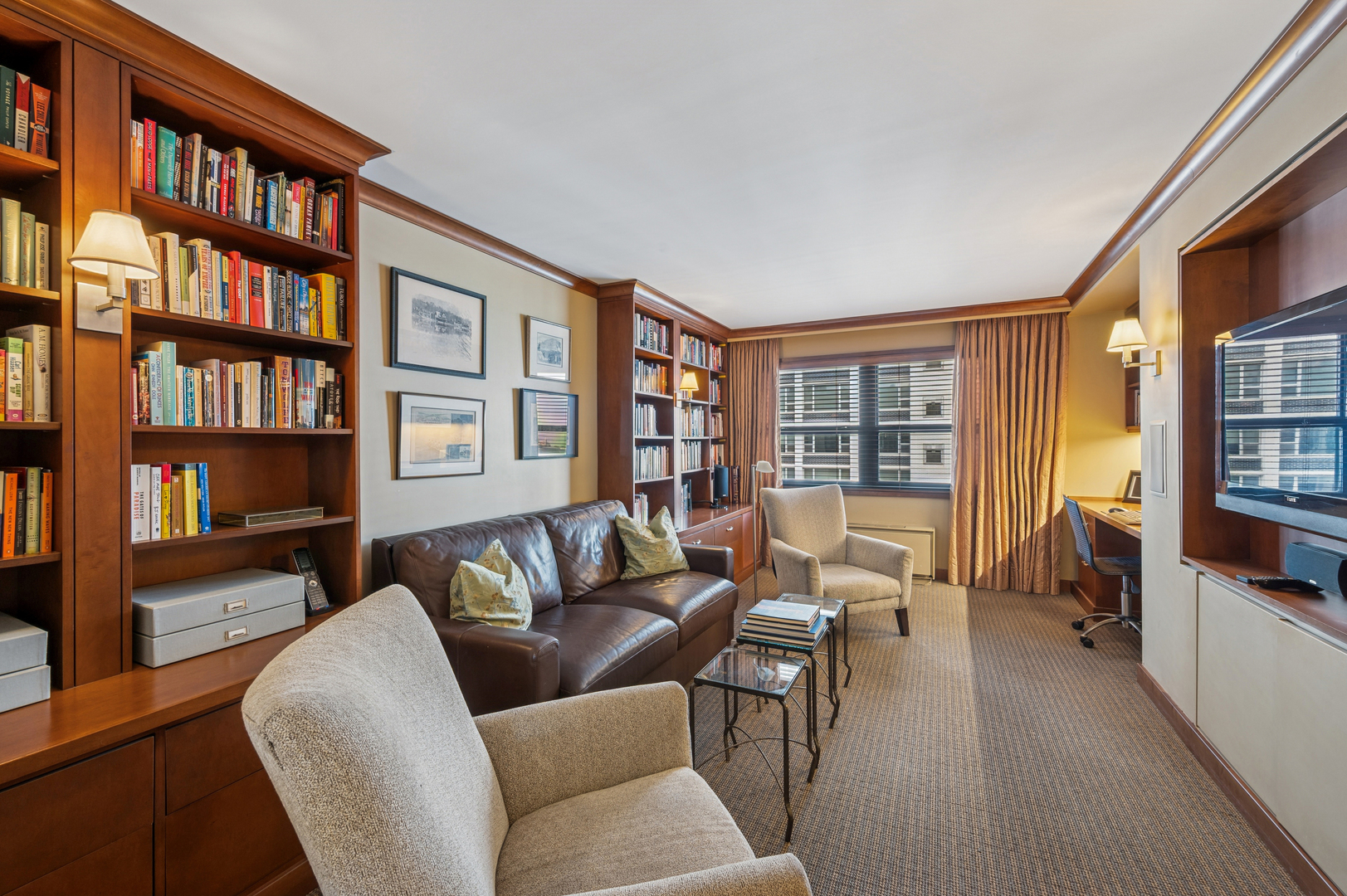 1313 North Ritchie Court, Unit 2701 Chicago, IL 60610 - Photo 16 of 33 a living room with furniture and a book shelf