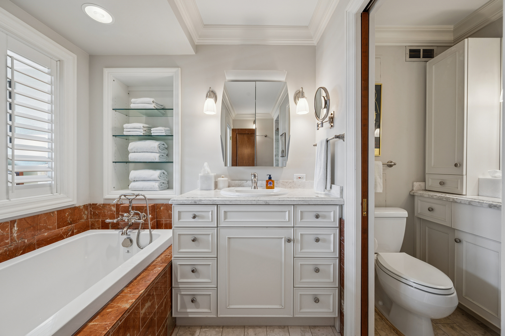 1313 North Ritchie Court, Unit 2701 Chicago, IL 60610 - Photo 21 of 33 a spacious bathroom with a double vanity sink a mirror a toilet and a window