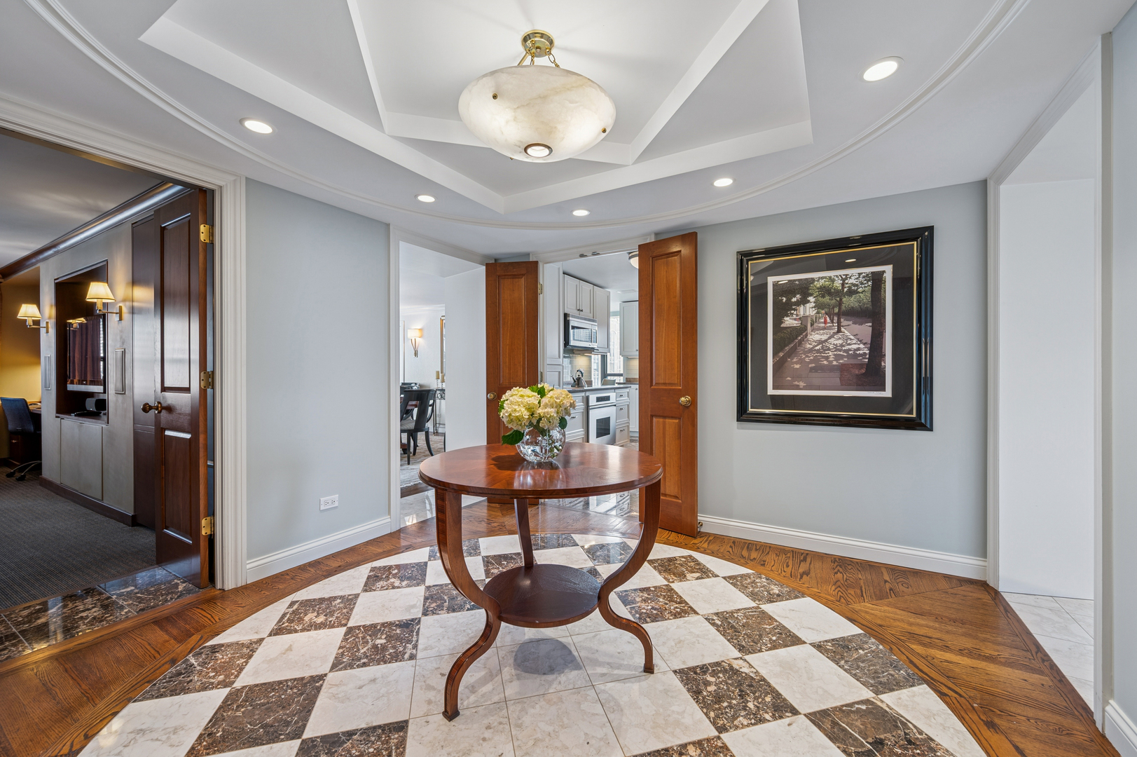 1313 North Ritchie Court, Unit 2701 Chicago, IL 60610 - Photo 4 of 33 a dining room with a table and chairs